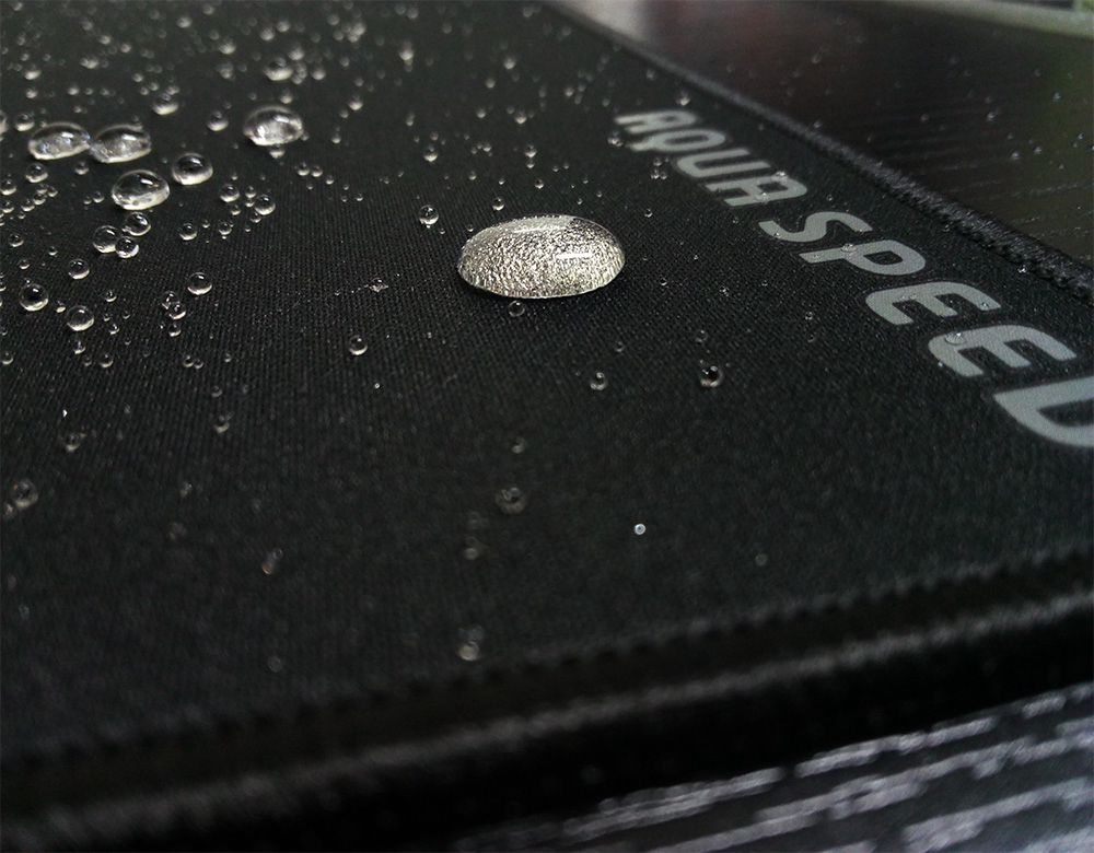 Close-up view water on the surface of mouse pad logo area aqua-speed-mouse-pads-water-proof-surface